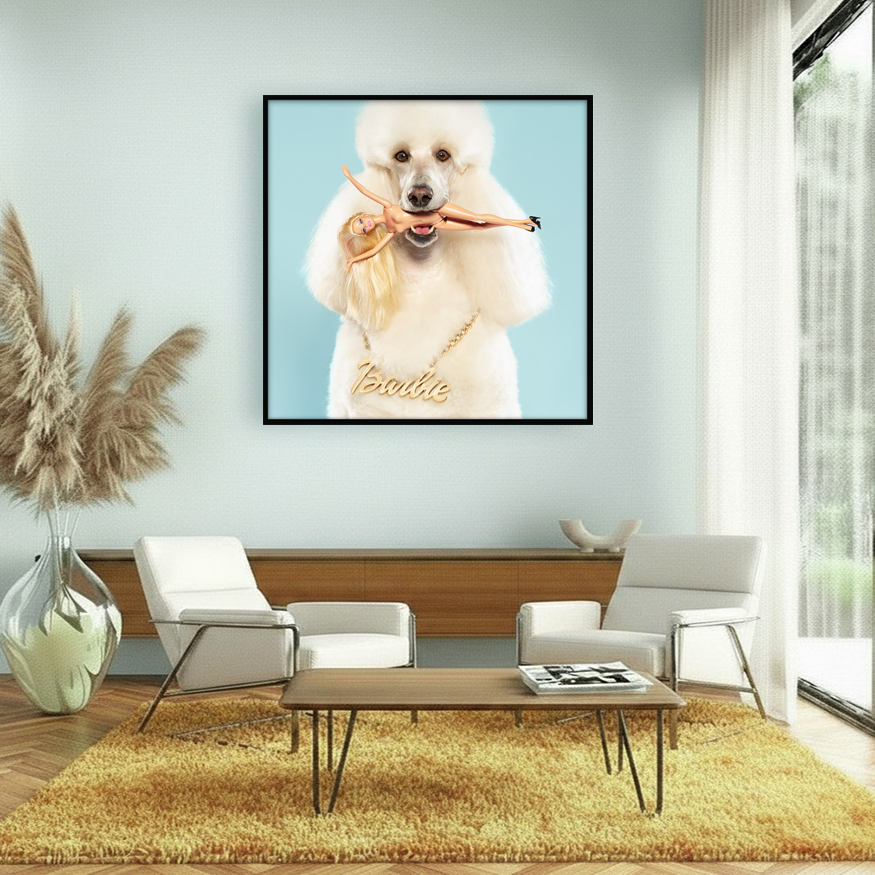 White Standard Poodle wearing a gold Barbie necklace, holds a naked Barbie doll with blond hair and black high heels in its mouth.