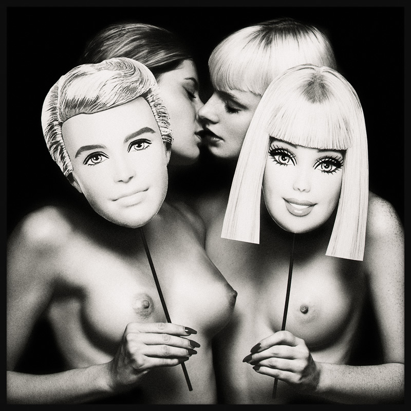 Secret Passion shows two women, partly hidden behind Barbie and Ken masks, leaning in to kiss, in a sensual, mysterious atmosphere.