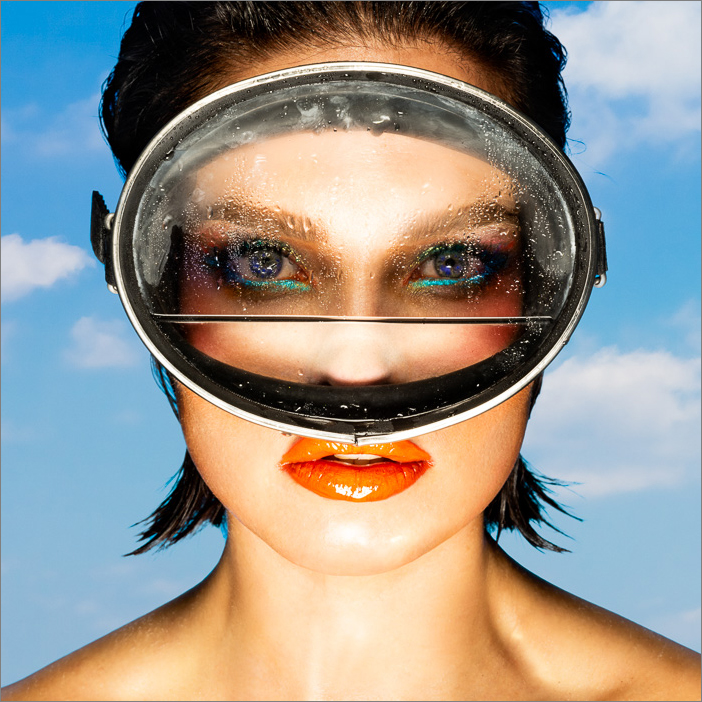 Vibrant artwork of a young woman diver with goggles, featuring bold colors, a powerful expression, still wet from an adventurous dive.
