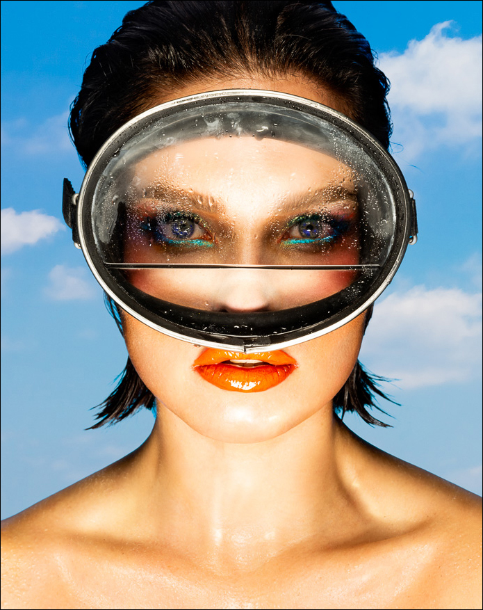 Vibrant artwork of a young woman diver with goggles, featuring bold colors, a powerful expression, still wet from an adventurous dive.