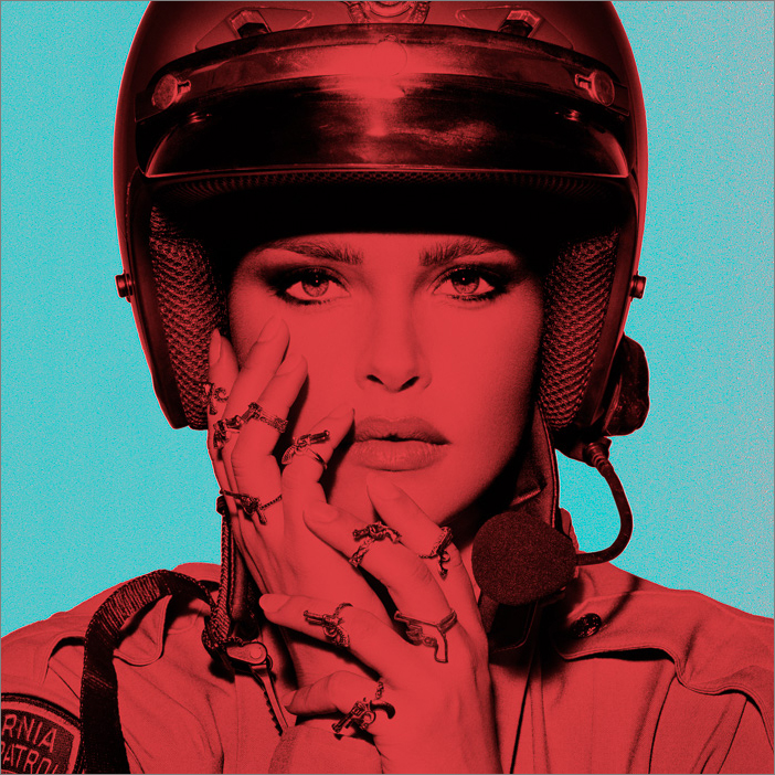 Bold colored B/W artwork of a young female police officer with gun rings, exploring strength, gender, and authority in modern society.