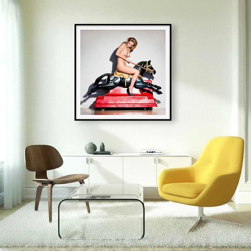 Interior with surreal art with a kiddy ride, featuring a bold woman exploring strength and gender through vintage photography.
