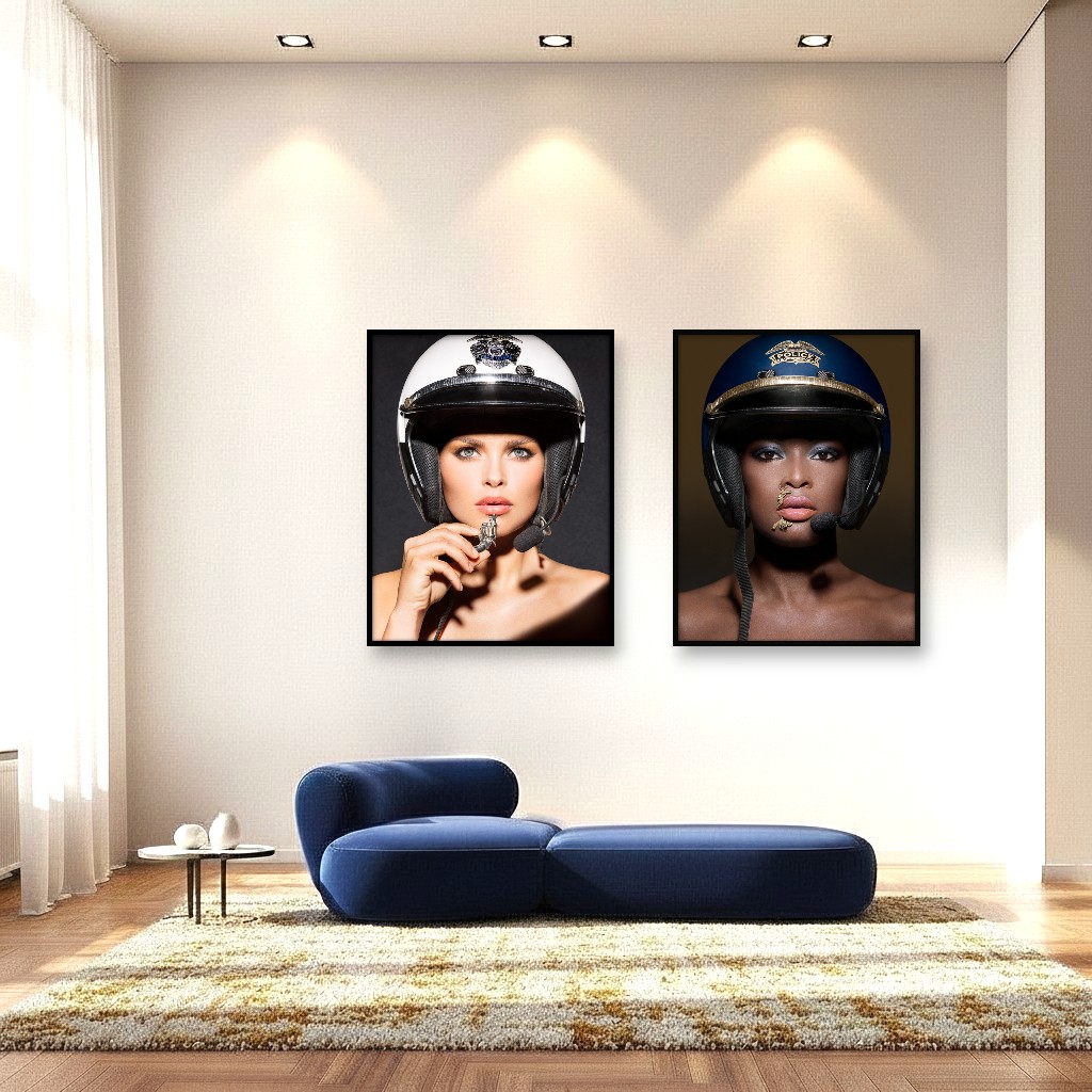 Two artworks on a wall: a white policewoman with a toy gun and a black officer with gun-shaped piercings, exploring power and race.