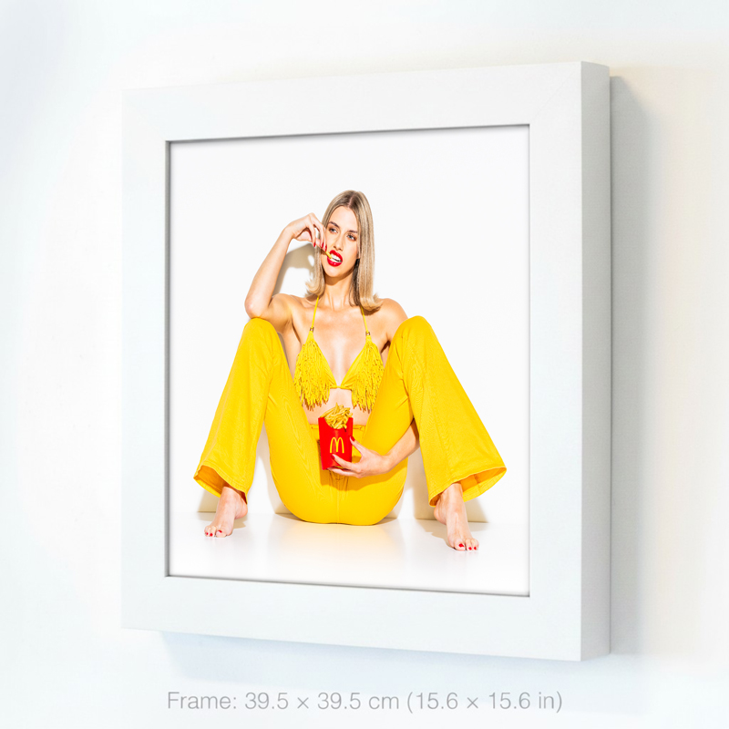 Girl in yellow pants forms McDonald’s arches while eating Mac Fries from iconic red box—bold McDonalds pop art on fast food culture.
