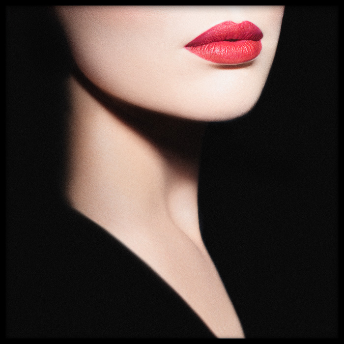 Mysterious red lips portrait, a close-up of a woman with striking red lips, pale skin, and elegance, evoking allure and intrigue.