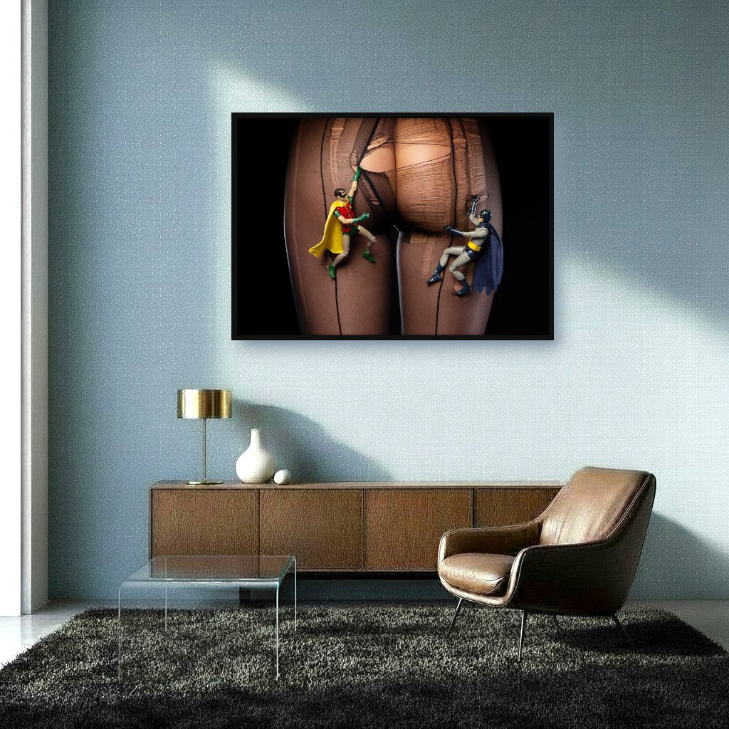 Interior with artwork of Batman and Robin at night, mounting legs and buttocks of woman with black ripped tights, uncovering buttocks.