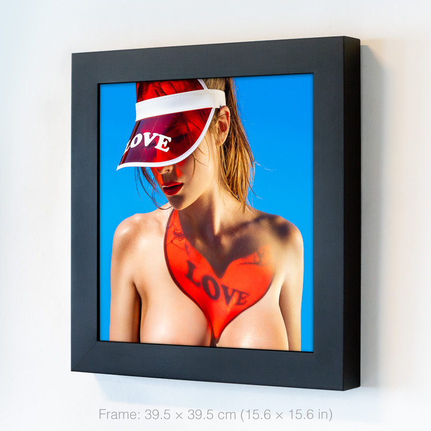 Vibrant red love heart projection on skin through red visor, radiant Miami sunlight creating sensual, summer vibes with golden glow.