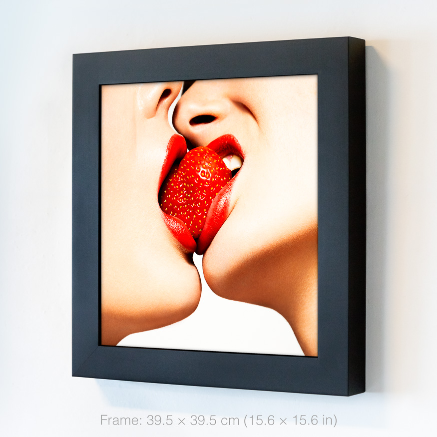 Red Kiss strawberry close-up, showcasing sensuality and passion as two women share a strawberry, symbolizing intimacy and desire.